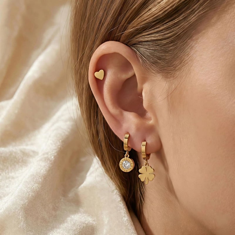 A set of three pairs of gold earrings; combining a delicate heart-shaped design, dangling circles with sparkling zircon stones, and a charming dangling rose. Made of durable stainless steel for a unique look. - Image 2
